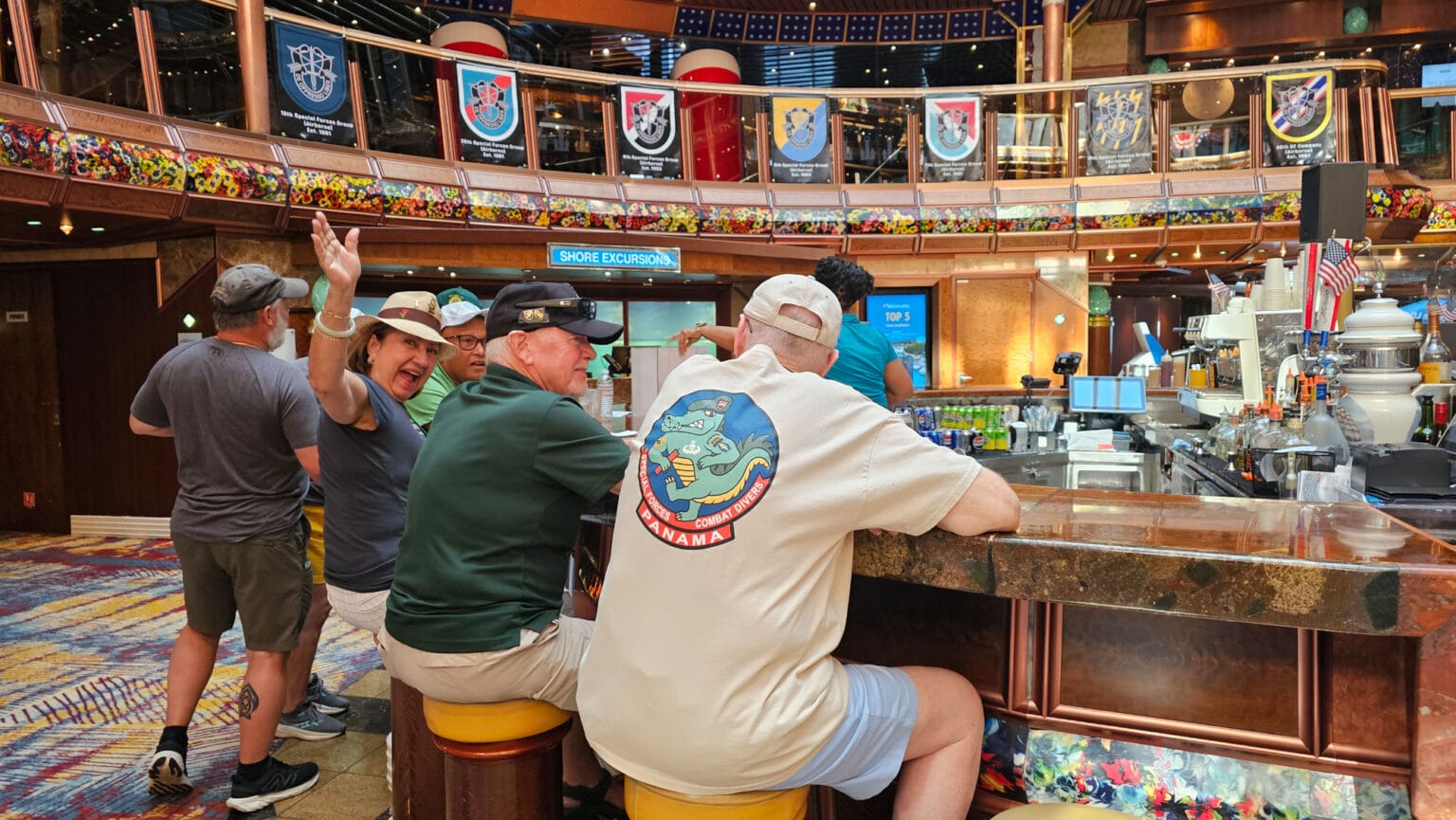 Woman waving at cruise ship bar counter