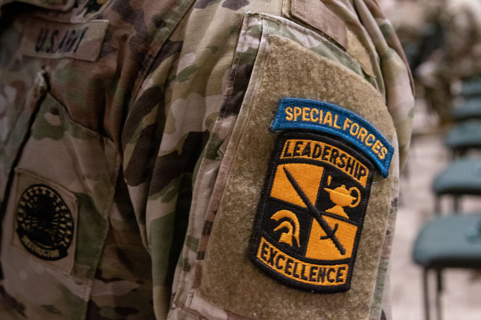 U.S. Army Special Forces patch on camo uniform.