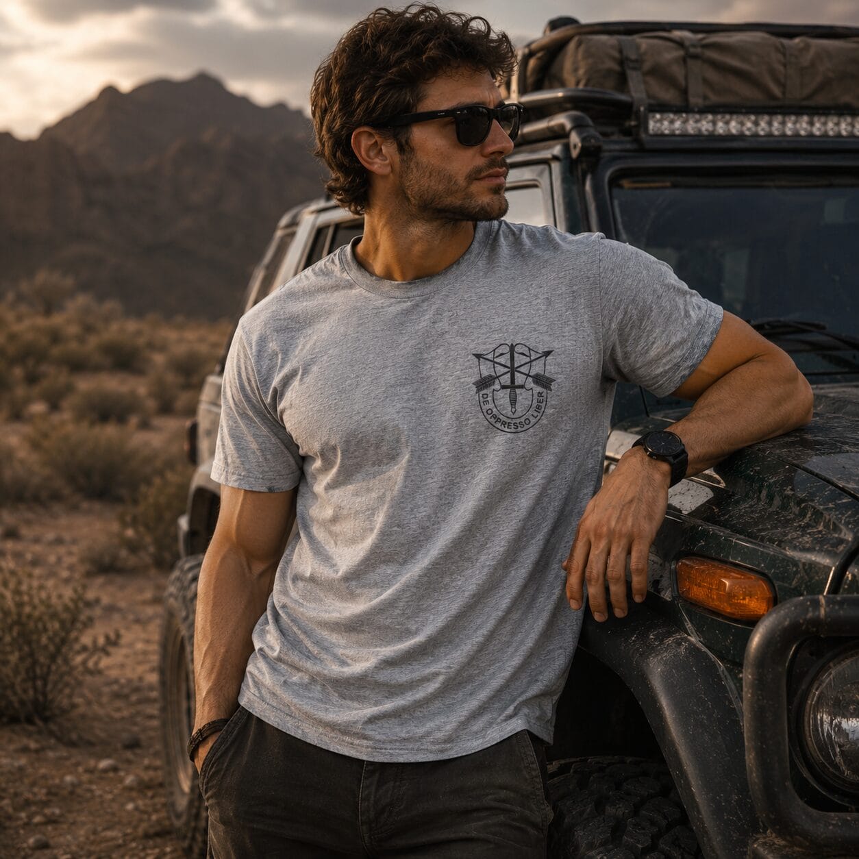 Man leaning on off-road SUV in desert