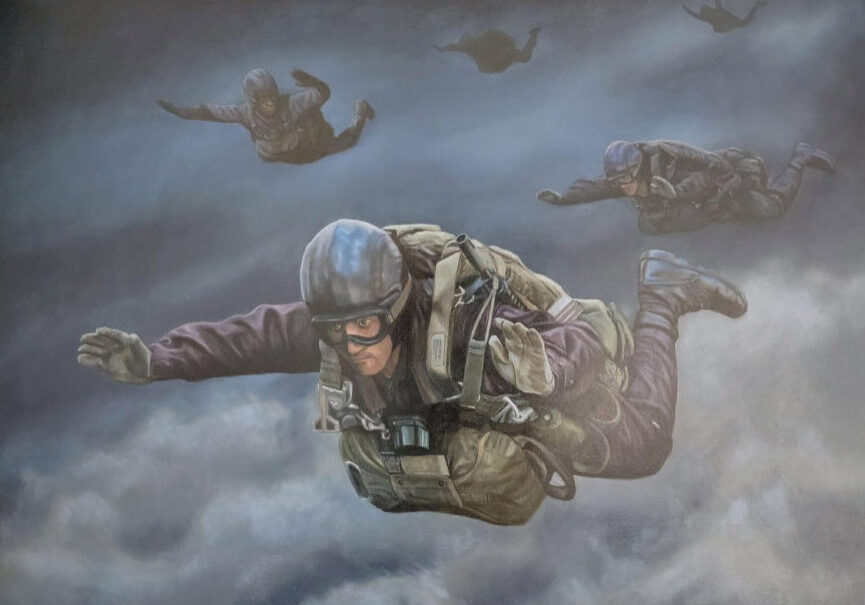 Paratroopers skydiving through cloudy sky.