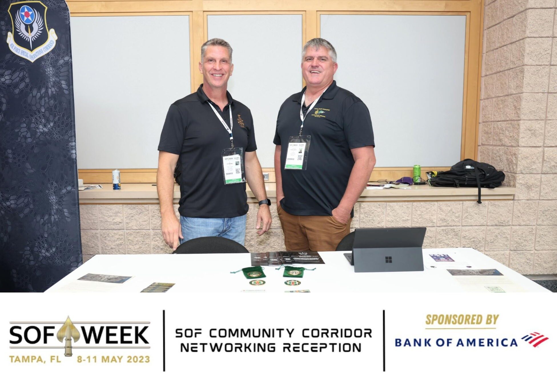 Two men at SOF Week networking booth