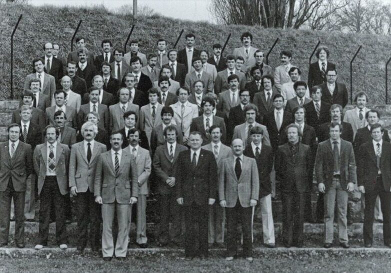Large group of men in suits outdoors